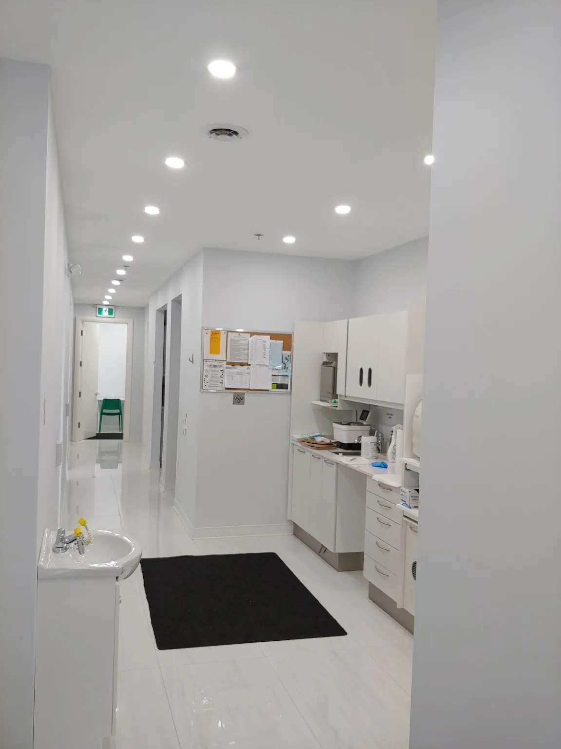 Bright hallway leading to the treatment rooms at Aras Dentistry