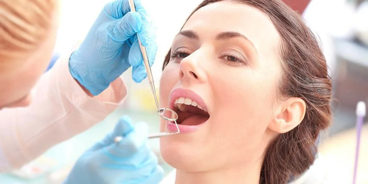 Patient having a dental check-up and cleaning