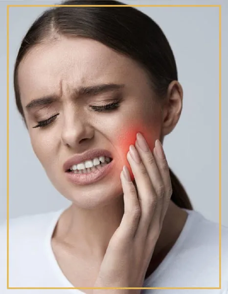 Woman holding her cheek with a painful toothache